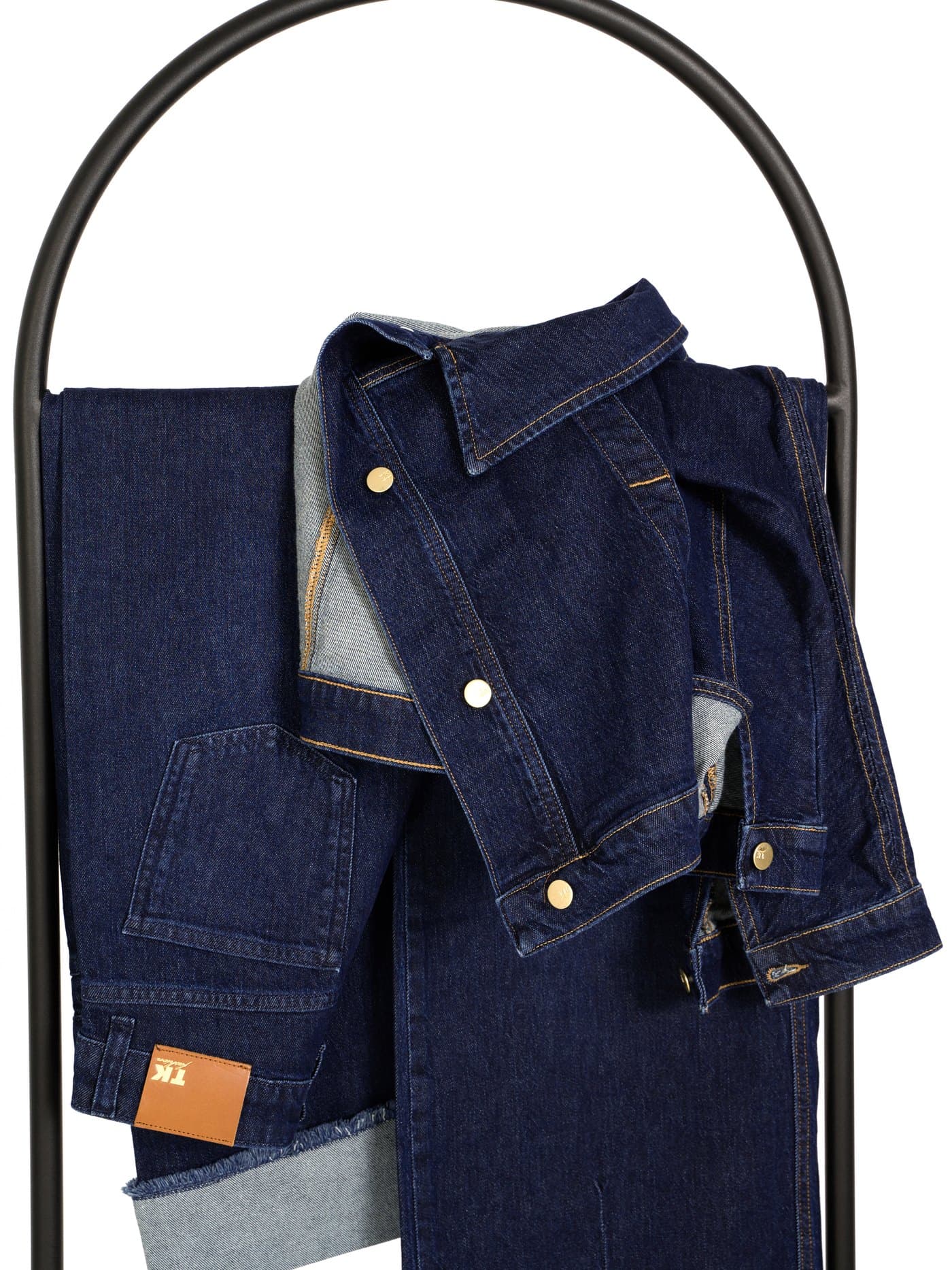 TK Fashion — denim jacket draped on a stand